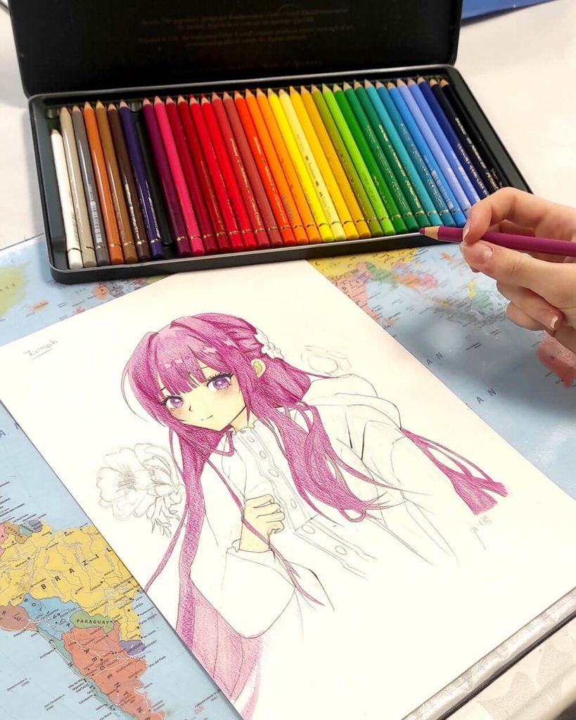 Ado dessinant une illustration manga médiéval fantastique inspiré des isekai aux crayons de couleurs Polychromos, cours de dessin manga à l'Atelier Adya, 3 rue du Printemps, Orvault.